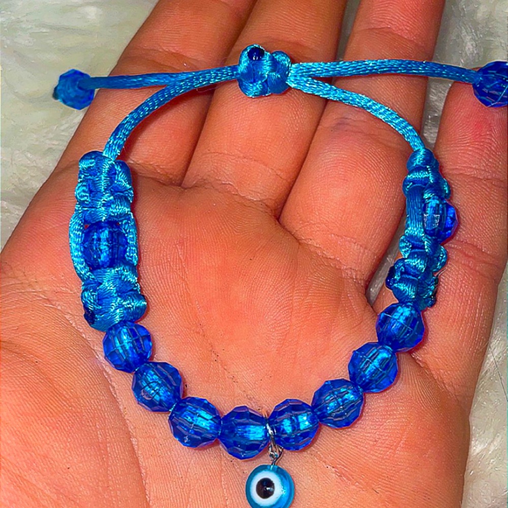 Blue with evil eye light and fits well and on anyone and with blue beads